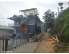 Fully Furnished Residential building of A Class Construction including retaining Wall, Brest Wall, House Hold Goods (Damage due to a heavy rain & landslide) – 01 house